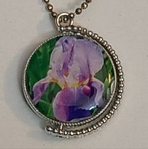 Necklace, double sided. One inch round.